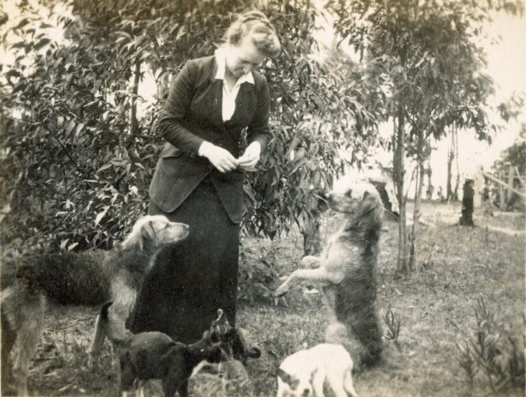 Principal Minnie Roseby and her dogs, c. 1916